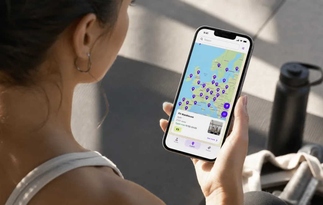 Employee browsing partner gyms across Europe in the Fitual app